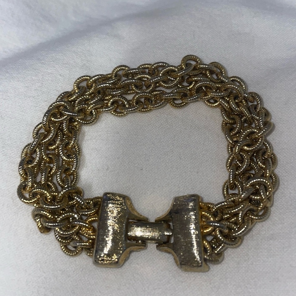 Vintage gold tone textured interlocking multi chain fold over clasp bracelet